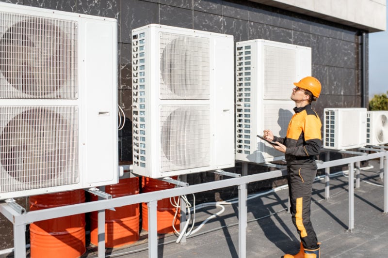 Technician working on Commercial Rooftop Units.