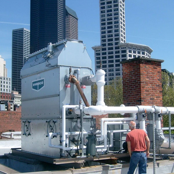 Newly installed Evapco unit on rooftop in city.