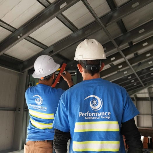 Performance Mechanical Group’s technicians working on unit in new construction.